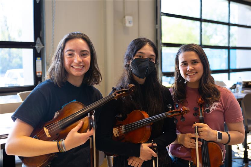 Students play in orchestra
